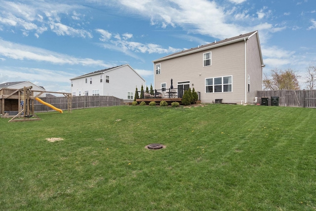 173 Willowwood Dr N, Oswego, IL 60543 - back of house with a playground, a wooden deck, and central AC unit