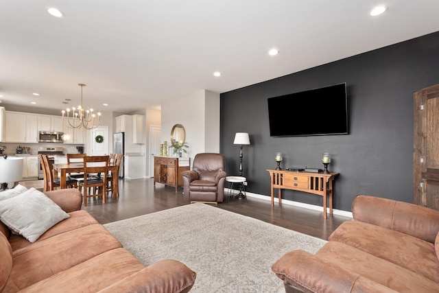 173 Willowwood Dr N, Oswego, IL 60543 - living room featuring a chandelier, recessed lighting, wood finished floors, and baseboards