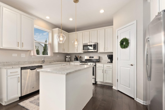173 Willowwood Dr N, Oswego, IL 60543 - kitchen with appliances with stainless steel finishes, a sink, dark wood-type flooring, white cabinets, and recessed lighting