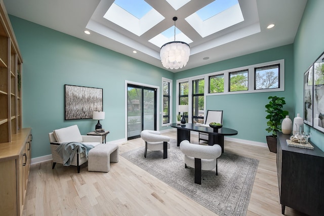 office with a skylight, a chandelier, a raised ceiling, baseboards, and recessed lighting