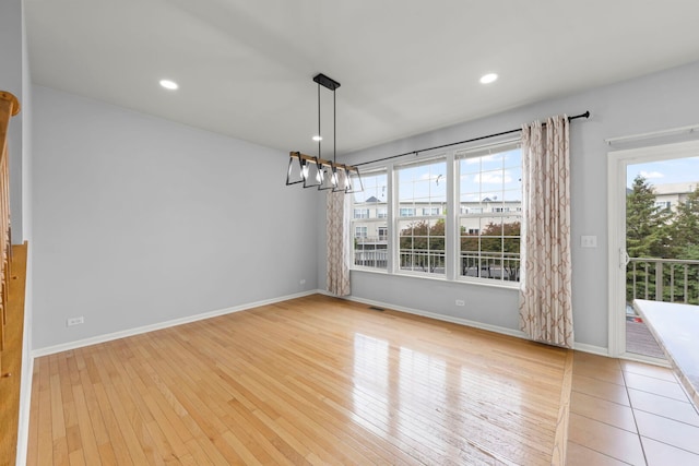4216 Drexel Ave, Aurora, IL 60504 - unfurnished dining area featuring wood-type flooring, a chandelier, baseboards, and recessed lighting