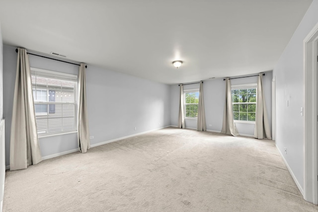 4216 Drexel Ave, Aurora, IL 60504 - spare room with carpet floors, baseboards, and healthy amount of natural light