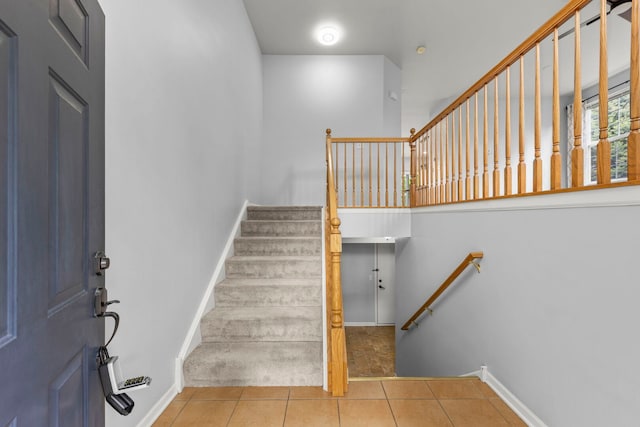 4216 Drexel Ave, Aurora, IL 60504 - staircase featuring tile patterned floors and baseboards