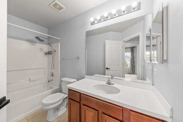 4216 Drexel Ave, Aurora, IL 60504 - bathroom featuring toilet, tile patterned flooring, vanity, and tub / shower combination