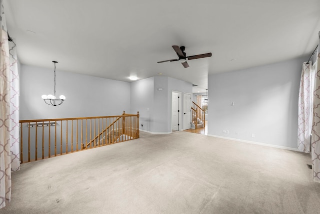 4216 Drexel Ave, Aurora, IL 60504 - empty room featuring a chandelier, carpet, a ceiling fan, and baseboards
