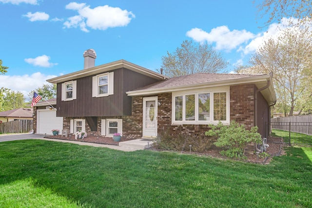 588 Renee Dr, South Elgin, IL 60177 - tri-level home featuring driveway, a garage, a chimney, and brick siding