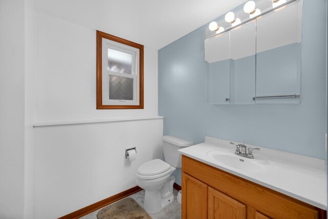 588 Renee Dr, South Elgin, IL 60177 - bathroom with toilet, vanity, and baseboards