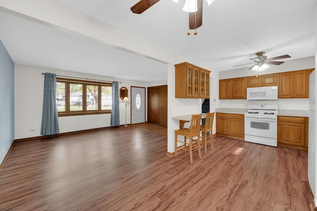 588 Renee Dr, South Elgin, IL 60177 - kitchen with white appliances, ceiling fan, and light wood finished floors
