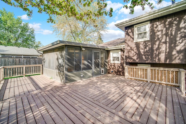 588 Renee Dr, South Elgin, IL 60177 - wooden deck with a sunroom and fence