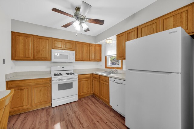 588 Renee Dr, South Elgin, IL 60177 - kitchen with white appliances, a sink, light wood-style flooring, light countertops, and a ceiling fan