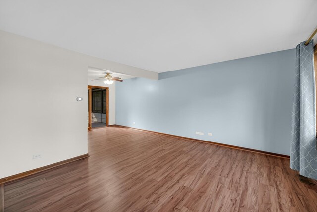 588 Renee Dr, South Elgin, IL 60177 - spare room with wood finished floors, baseboards, and ceiling fan