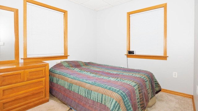 bedroom with light carpet