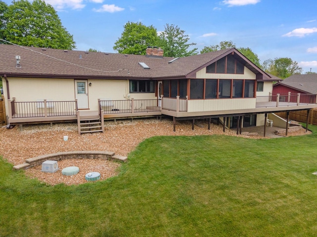 12225 W 187th St, Mokena, IL 60448 - rear view of property with a sunroom, a deck, a chimney, and a lawn