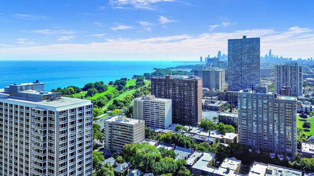 view of urban area featuring a nearby body of water