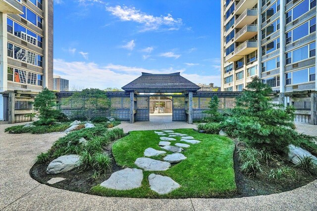 view of community featuring a gazebo and fence