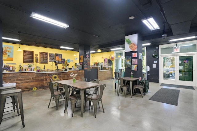 dining area with concrete flooring