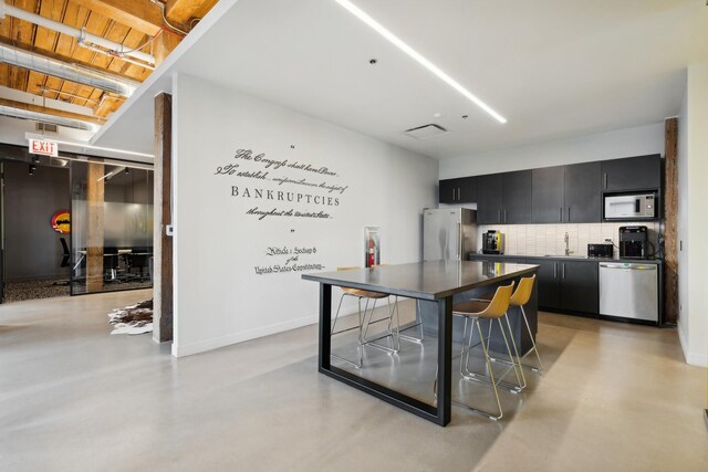 1327 W Washington Blvd Unit 5G-H, Chicago, IL 60607 - kitchen featuring dishwasher, freestanding refrigerator, dark cabinets, and finished concrete floors
