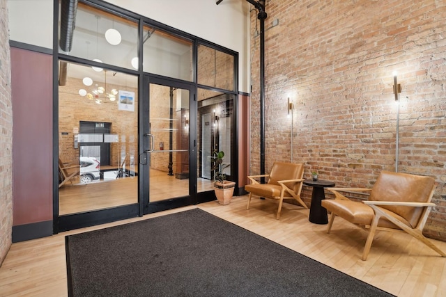 1327 W Washington Blvd Unit 5G-H, Chicago, IL 60607 - common area with a towering ceiling and brick wall