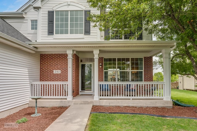 241 Morgan Valley Dr, Oswego, IL 60543 - property entrance featuring a porch and brick siding