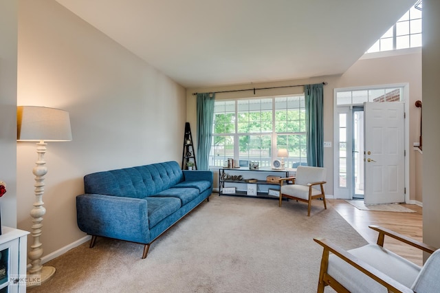 241 Morgan Valley Dr, Oswego, IL 60543 - living room with plenty of natural light, baseboards, carpet floors, and lofted ceiling