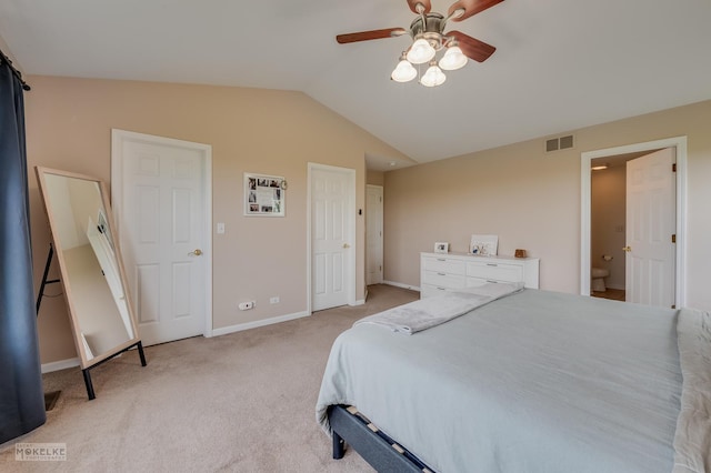 241 Morgan Valley Dr, Oswego, IL 60543 - bedroom with vaulted ceiling, light carpet, baseboards, a ceiling fan, and ensuite bathroom