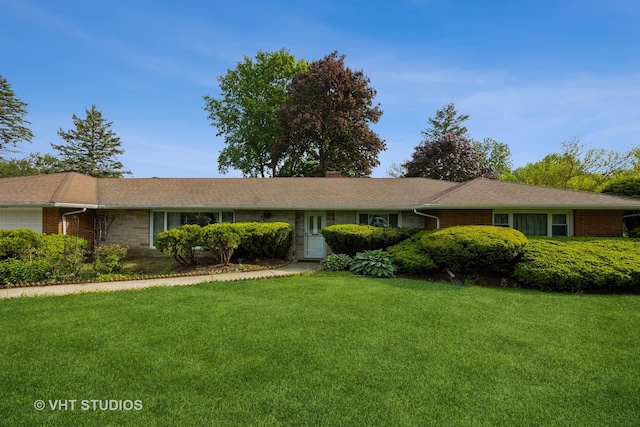 1715 W Main St, Sleepy Hollow, IL 60118 - ranch-style home featuring a front yard, a garage, and brick siding