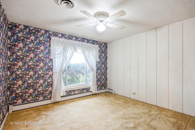 1715 W Main St, Sleepy Hollow, IL 60118 - empty room with wallpapered walls, carpet flooring, a textured ceiling, ceiling fan, and a baseboard radiator