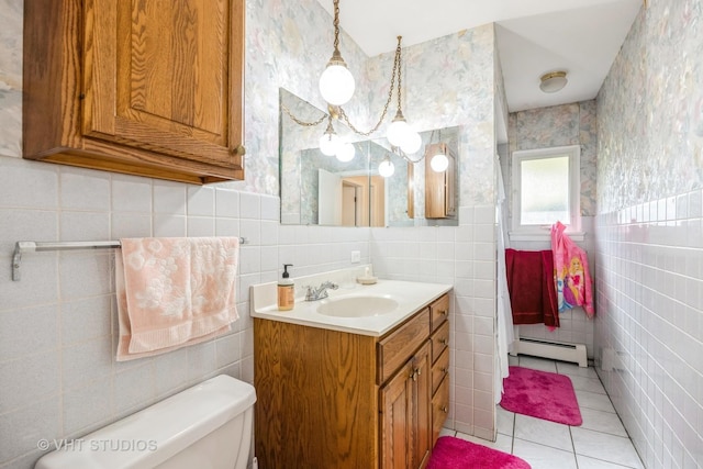 1715 W Main St, Sleepy Hollow, IL 60118 - bathroom featuring baseboard heating, tile walls, vanity, tile patterned flooring, and toilet