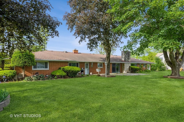 1715 W Main St, Sleepy Hollow, IL 60118 - single story home featuring a chimney, a front yard, and brick siding