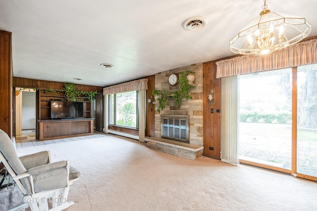 1715 W Main St, Sleepy Hollow, IL 60118 - unfurnished living room with wood walls, carpet floors, a baseboard heating unit, a chandelier, and a fireplace