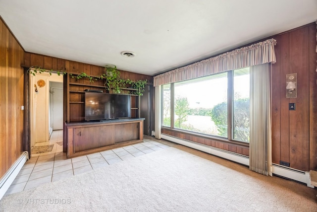 1715 W Main St, Sleepy Hollow, IL 60118 - unfurnished living room with baseboard heating, wood walls, light tile patterned floors, and light carpet