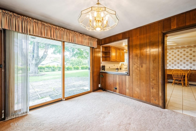1715 W Main St, Sleepy Hollow, IL 60118 - kitchen with a chandelier, brown cabinets, light colored carpet, open shelves, and wooden walls