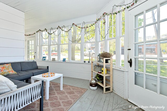 10208 N Main St, Richmond, IL 60071 - sunroom / solarium with hardwood / wood-style flooring, an outdoor hangout area, and wooden walls
