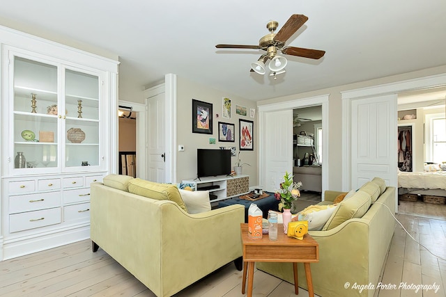 10208 N Main St, Richmond, IL 60071 - living room featuring a ceiling fan and light wood-style floors