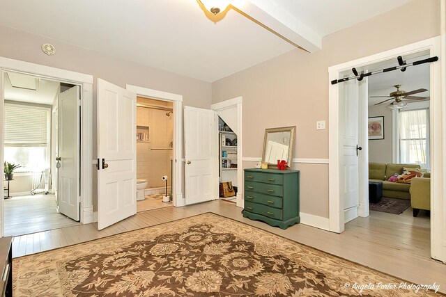 10208 N Main St, Richmond, IL 60071 - bedroom with light wood-style floors, multiple windows, beam ceiling, and baseboards