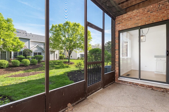 unfurnished sunroom featuring healthy amount of natural light
