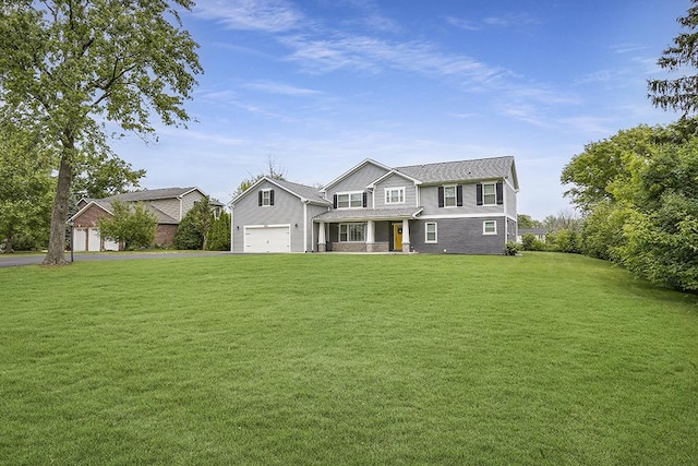8081 Tennessee Ave, Willowbrook, IL 60527 - traditional home with a front yard, covered porch, driveway, and an attached garage