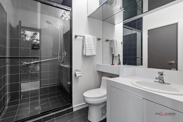 2100 Pfingsten Rd, Northbrook, IL 60062 - full bathroom with toilet, a shower stall, tile patterned floors, and vanity