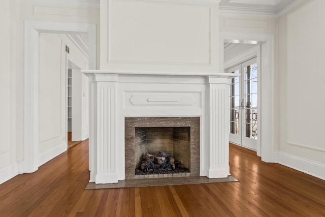 240 Lee St Unit 3, Evanston, IL 60202 - detailed view of a fireplace with flush hearth, wood finished floors, and crown molding