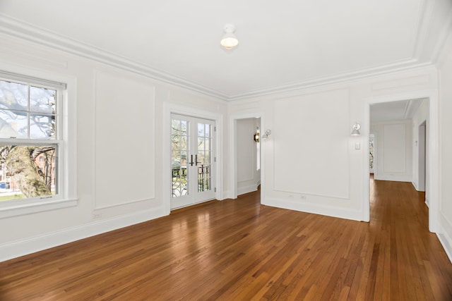 240 Lee St Unit 3, Evanston, IL 60202 - unfurnished living room with wood-type flooring, ornamental molding, french doors, and a decorative wall