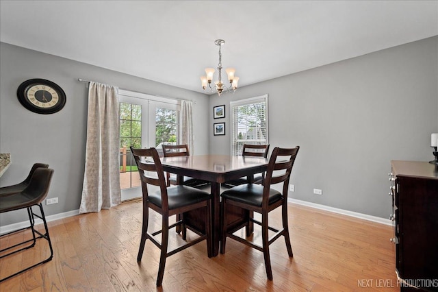 311 Mayfair Ln, South Elgin, IL 60177 - dining space with a chandelier, light wood-style floors, and baseboards