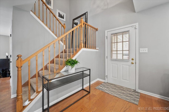 311 Mayfair Ln, South Elgin, IL 60177 - entryway with wood finished floors, baseboards, and stairs