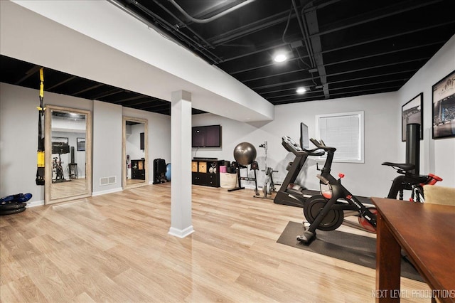 311 Mayfair Ln, South Elgin, IL 60177 - workout area with wood finished floors and baseboards