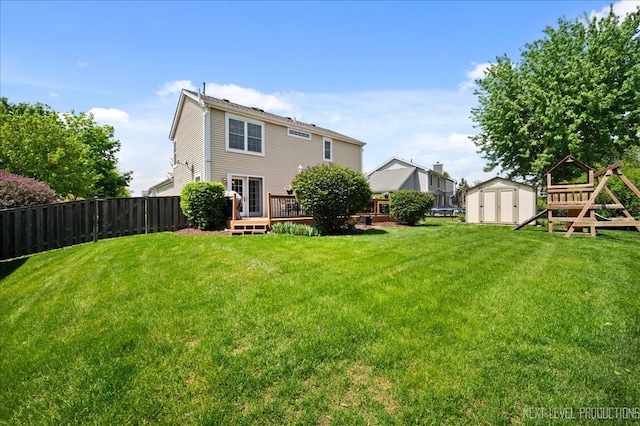 311 Mayfair Ln, South Elgin, IL 60177 - back of house with a storage unit, a wooden deck, and an outdoor structure