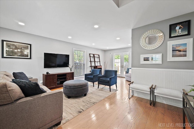 311 Mayfair Ln, South Elgin, IL 60177 - living area with wood finished floors, wainscoting, recessed lighting, and french doors