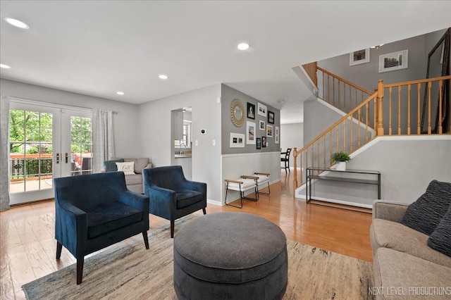 311 Mayfair Ln, South Elgin, IL 60177 - living area featuring light wood finished floors, stairway, recessed lighting, french doors, and wainscoting