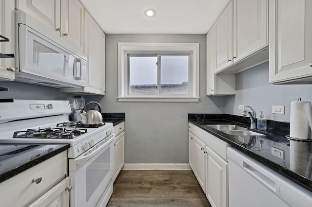 7435 N Ridge Blvd Unit 3B, Chicago, IL 60645 - kitchen featuring white appliances, a sink, dark wood-type flooring, white cabinets, and recessed lighting