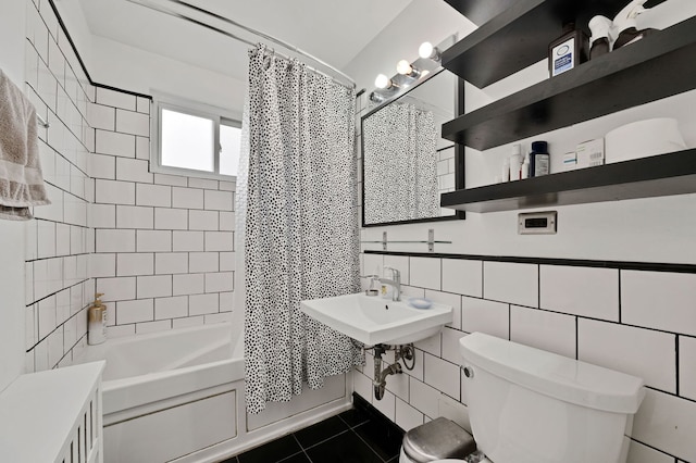 7435 N Ridge Blvd Unit 3B, Chicago, IL 60645 - bathroom with toilet, shower / bath combination with curtain, tile patterned flooring, a sink, and tile walls