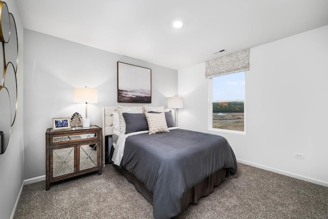 bedroom featuring carpet floors and baseboards