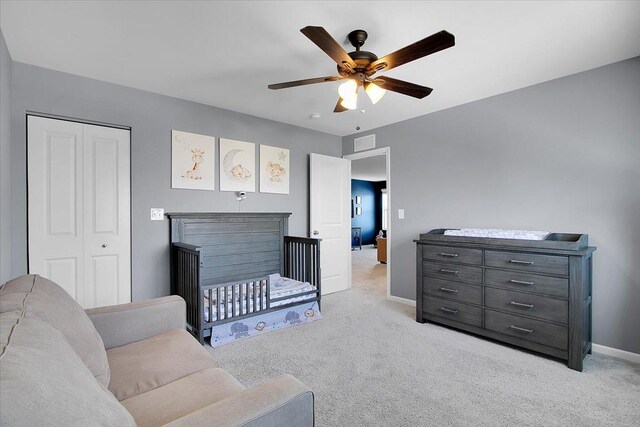 6103 Winterhaven Dr, Joliet, IL 60431 - bedroom with light colored carpet, baseboards, a closet, and ceiling fan